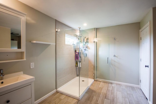 108 Regency Ct, Highland Heights, KY 41076 - bathroom with a stall shower, wood finished floors, and vanity