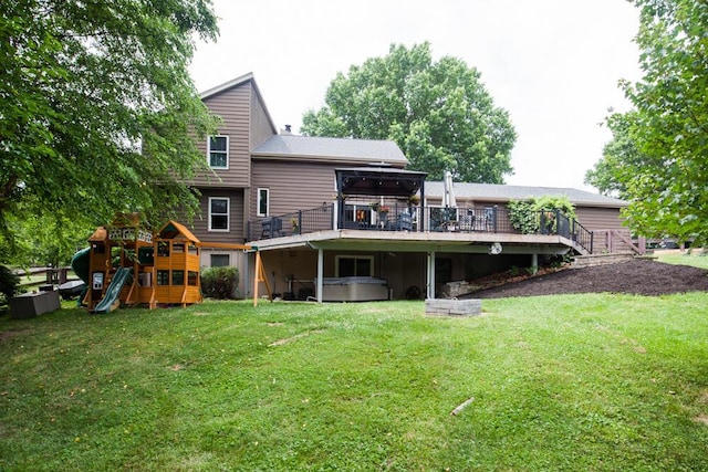 108 Regency Ct, Highland Heights, KY 41076 - back of house featuring a hot tub, a playground, a lawn, and a wooden deck