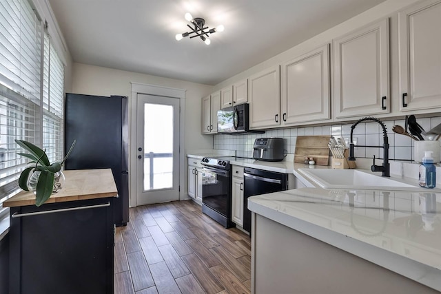 406 Hallam Ave, Erlanger, KY 41018 - kitchen with stainless steel appliances, tasteful backsplash, wood finished floors, and white cabinets