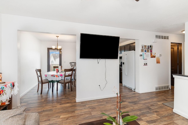 1539 Raintree Ct, Elsmere, KY 41018 - living room featuring dark wood-type flooring and a chandelier