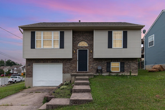 1539 Raintree Ct, Elsmere, KY 41018 - bi-level home featuring brick siding, a lawn, concrete driveway, and a garage