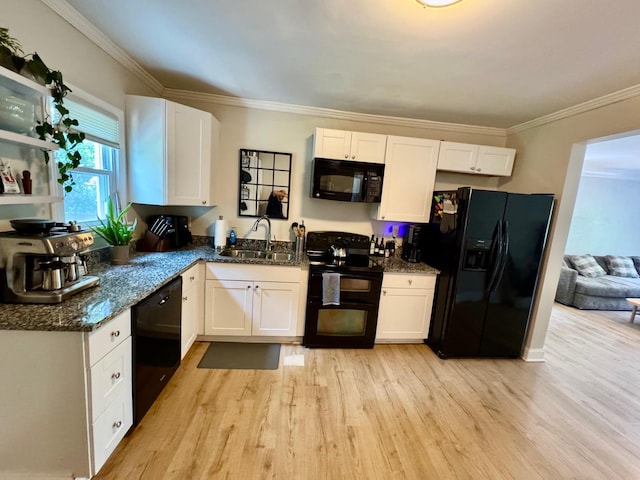 2543 Enid Ave, Crescent Springs, KY 41017 - kitchen with black appliances, light wood-style flooring, white cabinets, ornamental molding, and dark stone counters
