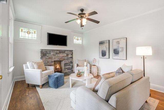 343 Rossford Ave, Fort Thomas, KY 41075 - living area featuring ceiling fan, wood finished floors, a stone fireplace, and crown molding