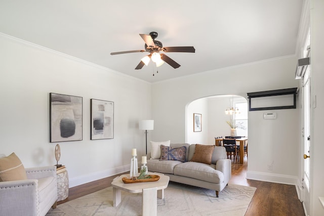 343 Rossford Ave, Fort Thomas, KY 41075 - living room with arched walkways, a chandelier, a ceiling fan, wood finished floors, and crown molding