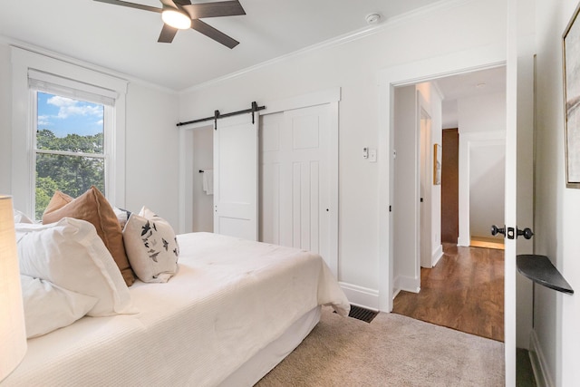 343 Rossford Ave, Fort Thomas, KY 41075 - bedroom featuring a barn door, ornamental molding, a closet, and ceiling fan