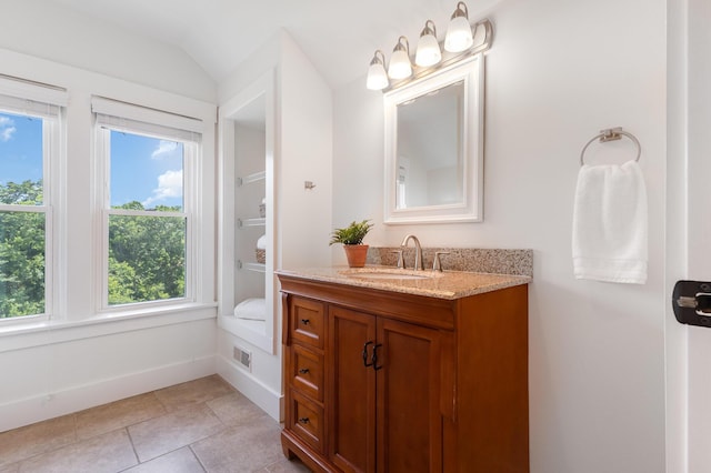 343 Rossford Ave, Fort Thomas, KY 41075 - bathroom featuring vanity, plenty of natural light, vaulted ceiling, and tile patterned flooring