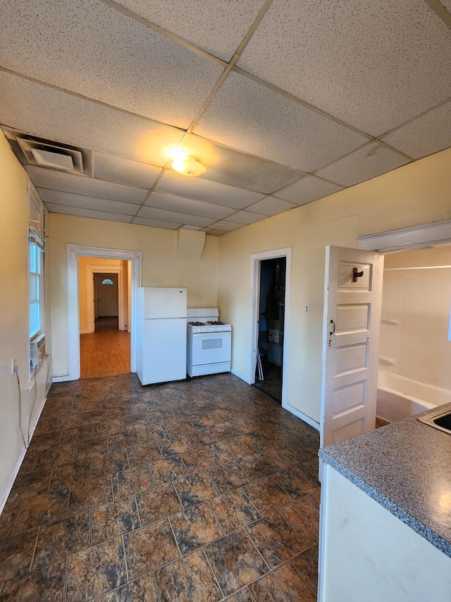 1539 Wheeler Aly, Covington, KY 41014 - kitchen with white appliances, a drop ceiling, and dark stone finish flooring
