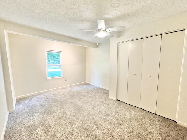 13165 Burns Rd, California, KY 41007 - unfurnished bedroom featuring carpet flooring, a textured ceiling, a closet, and a ceiling fan
