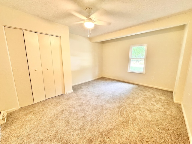 13165 Burns Rd, California, KY 41007 - unfurnished bedroom featuring a textured ceiling, carpet flooring, a closet, and ceiling fan