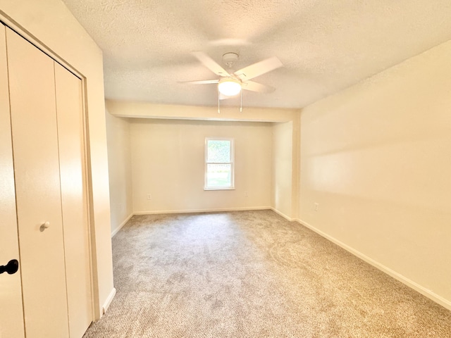 13165 Burns Rd, California, KY 41007 - unfurnished bedroom with a textured ceiling, carpet flooring, a closet, and a ceiling fan