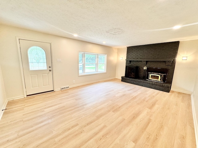 13165 Burns Rd, California, KY 41007 - unfurnished living room with a textured ceiling, a fireplace, wood finished floors, and recessed lighting