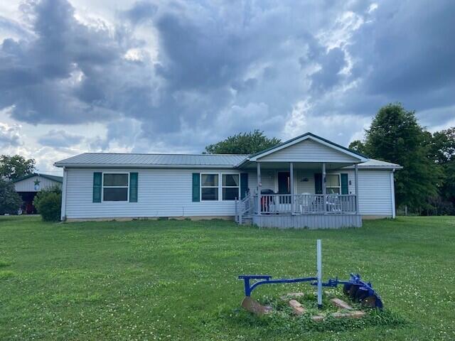 2060 Augusta Minerva Rd, Augusta, KY 41002 - ranch-style home featuring a porch, a front yard, and a metal roof