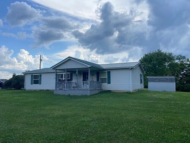 2060 Augusta Minerva Rd, Augusta, KY 41002 - ranch-style home with covered porch, a front lawn, a shed, and a metal roof