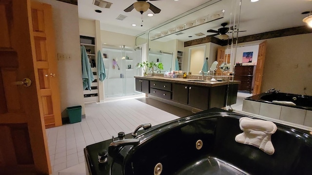 5809 Taylor Mill Rd, Covington, KY 41015 - bathroom featuring ceiling fan, a tub with jets, vanity, a shower stall, and a closet