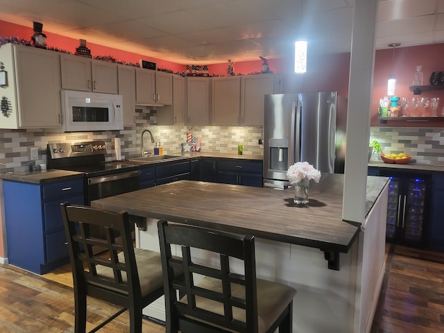 5809 Taylor Mill Rd, Covington, KY 41015 - kitchen with stainless steel appliances, dark wood-type flooring, backsplash, and butcher block countertops