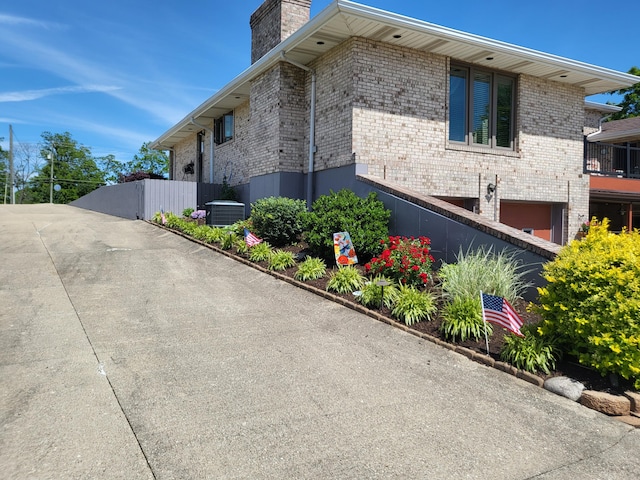 5809 Taylor Mill Rd, Covington, KY 41015 - view of home's exterior featuring a chimney and brick siding