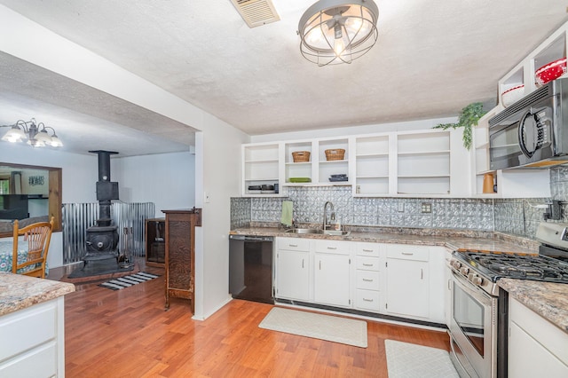 575 Sugar Creek Rd, Dry Ridge, KY 41035 - kitchen featuring black appliances, open shelves, light wood-type flooring, tasteful backsplash, and white cabinets