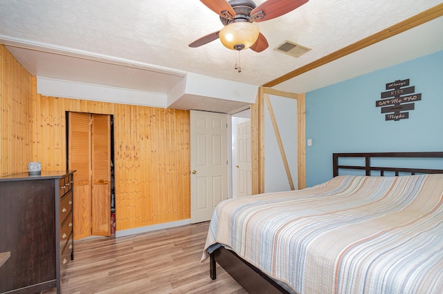575 Sugar Creek Rd, Dry Ridge, KY 41035 - bedroom featuring wood finished floors, wood walls, and a ceiling fan
