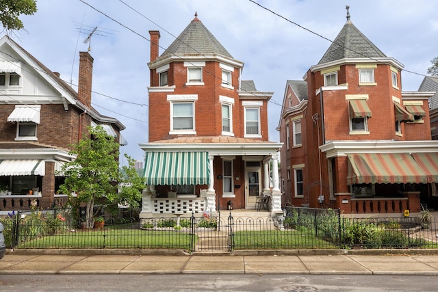 321 6th Ave, Dayton, KY 41074 - victorian house featuring a fenced front yard and brick siding