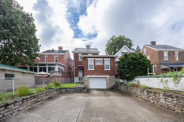 321 6th Ave, Dayton, KY 41074 - view of front facade featuring a garage and concrete driveway