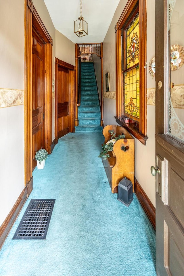 321 6th Ave, Dayton, KY 41074 - corridor with carpet floors, stairs, and a chandelier