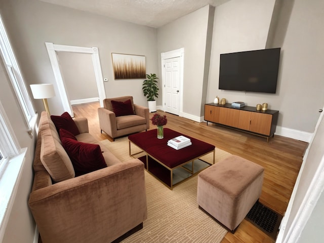 626 W 12th St, Covington, KY 41011 - living room with light wood-style flooring