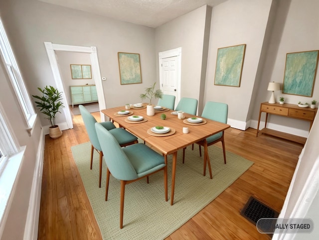 626 W 12th St, Covington, KY 41011 - dining space featuring light wood-style flooring