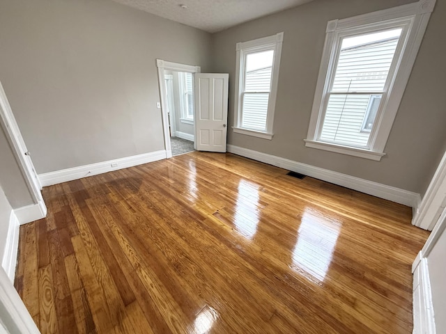 626 W 12th St, Covington, KY 41011 - unfurnished bedroom featuring wood finished floors and baseboards