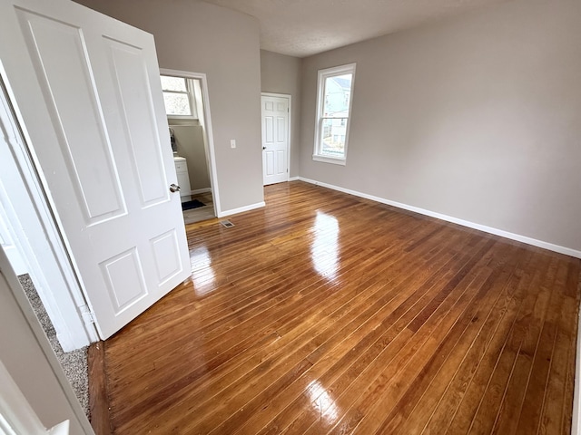 626 W 12th St, Covington, KY 41011 - unfurnished bedroom with hardwood / wood-style floors and baseboards