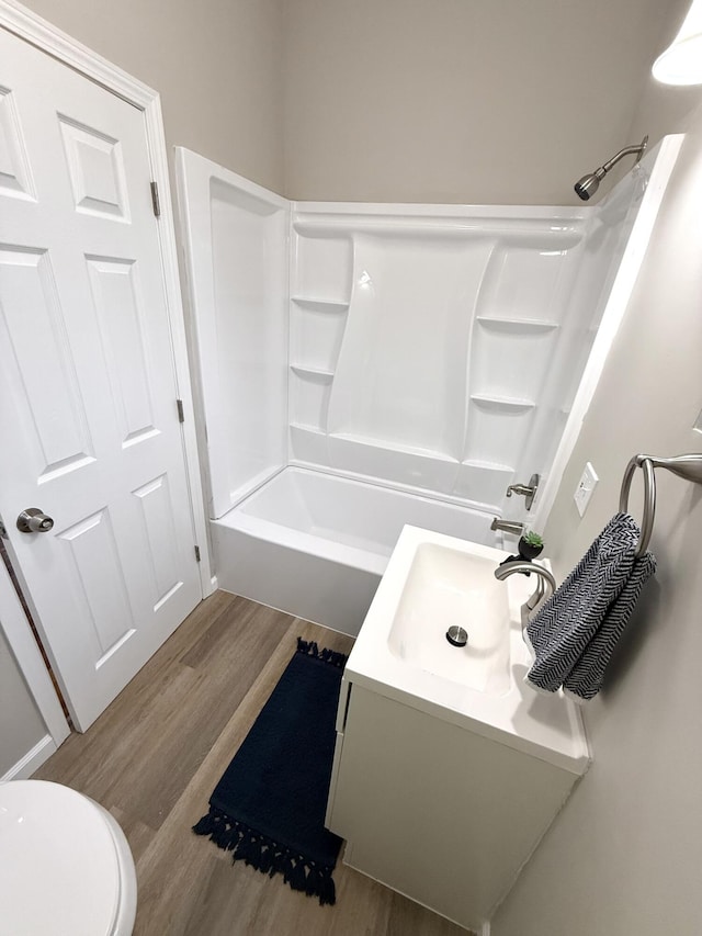 626 W 12th St, Covington, KY 41011 - bathroom with wood finished floors, vanity, and shower / bathtub combination