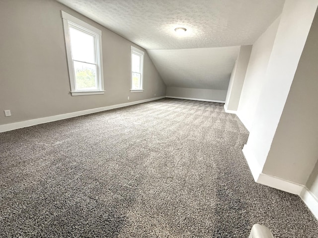 626 W 12th St, Covington, KY 41011 - bonus room with a textured ceiling, vaulted ceiling, and carpet flooring