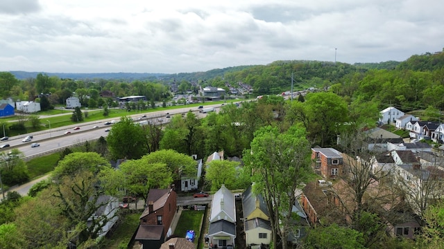 626 W 12th St, Covington, KY 41011 - aerial view of property and surrounding area with nearby suburban area and a forest