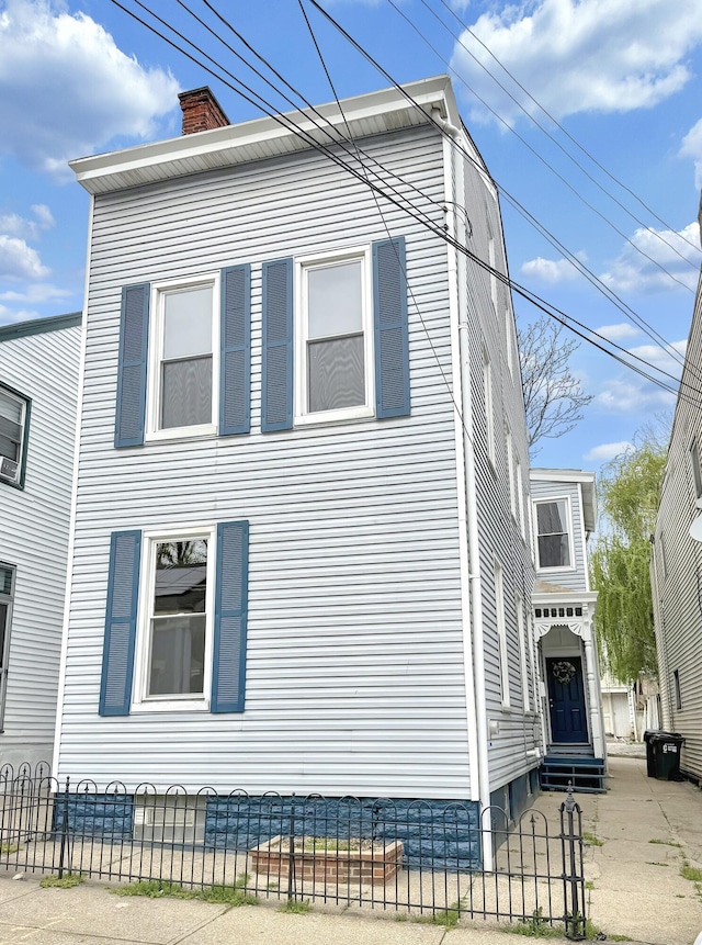 626 W 12th St, Covington, KY 41011 - view of property exterior featuring entry steps and a chimney