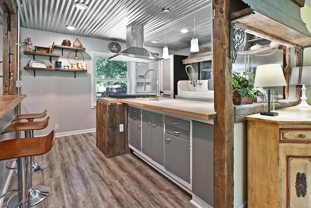 2520 Frank St, Villa Hills, KY 41017 - kitchen with island exhaust hood, wooden counters, gray cabinets, dark wood finished floors, and open shelves