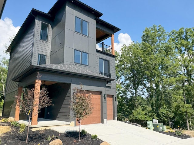 888 Belle Ridge Loop, Bellevue, KY 41073 - view of front of home with a balcony, an attached garage, and driveway