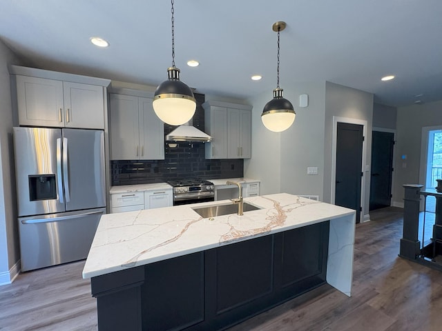 888 Belle Ridge Loop, Bellevue, KY 41073 - kitchen with stainless steel appliances, wall chimney exhaust hood, backsplash, a center island with sink, and wood finished floors