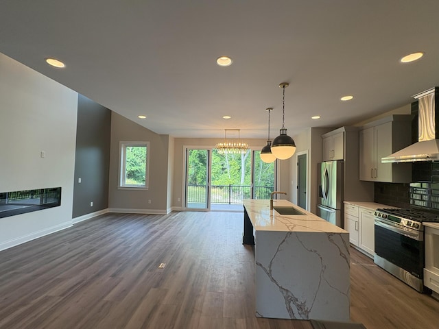 888 Belle Ridge Loop, Bellevue, KY 41073 - kitchen featuring appliances with stainless steel finishes, wall chimney exhaust hood, recessed lighting, a center island with sink, and tasteful backsplash
