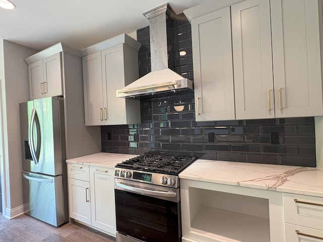 888 Belle Ridge Loop, Bellevue, KY 41073 - kitchen featuring stainless steel appliances, wall chimney range hood, light stone counters, and backsplash