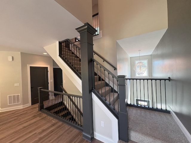 888 Belle Ridge Loop, Bellevue, KY 41073 - staircase with a chandelier and wood finished floors
