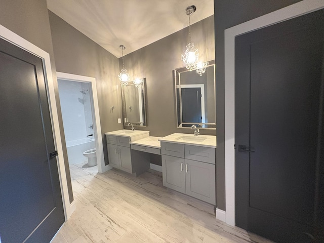 888 Belle Ridge Loop, Bellevue, KY 41073 - bathroom featuring vanity, wood finished floors, a chandelier, and bathing tub / shower combination