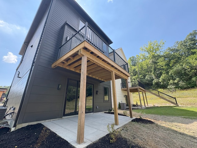 888 Belle Ridge Loop, Bellevue, KY 41073 - back of property featuring a wooden deck and a patio area