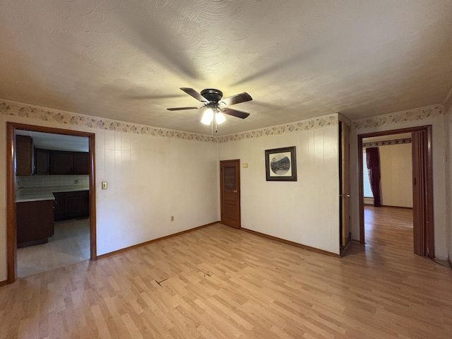 617 Woolery St, Falmouth, KY 41040 - empty room featuring light wood-type flooring, a ceiling fan, and a textured ceiling