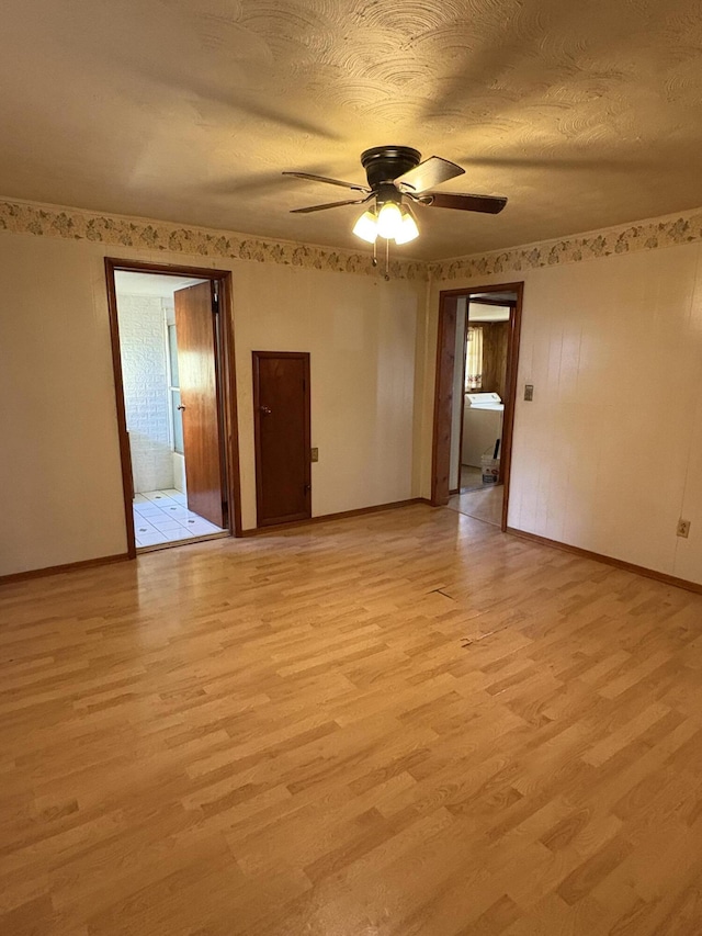 617 Woolery St, Falmouth, KY 41040 - empty room with a ceiling fan and light wood-style flooring
