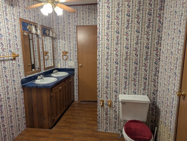 113 Lynn Ln, Falmouth, KY 41040 - bathroom with a ceiling fan, wood finished floors, double vanity, and wallpapered walls