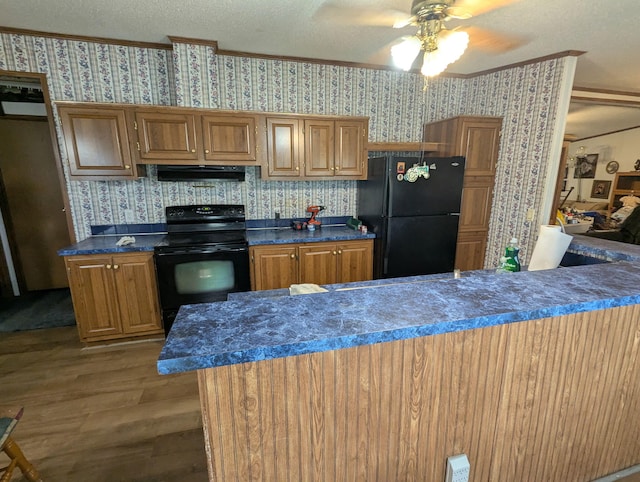 113 Lynn Ln, Falmouth, KY 41040 - kitchen with black appliances, wallpapered walls, wood finished floors, under cabinet range hood, and ceiling fan