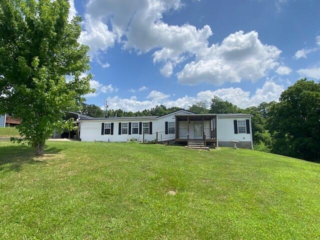 113 Lynn Ln, Falmouth, KY 41040 - rear view of house featuring a lawn