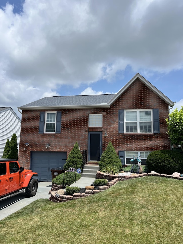 2768 Berwood Ln, Hebron, KY 41048 - view of front of home with an attached garage, brick siding, driveway, a front lawn, and entry steps