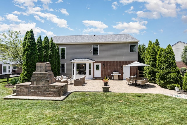 1312 Deer Hollow Ct, Hebron, KY 41048 - back of property featuring a patio area, a lawn, an outdoor hangout area, and brick siding