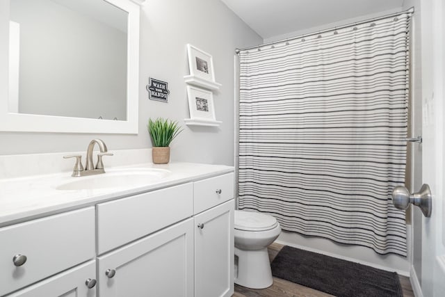 1312 Deer Hollow Ct, Hebron, KY 41048 - bathroom with vanity, wood finished floors, and shower / bath combo