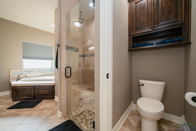 bathroom featuring tile patterned flooring, toilet, and independent shower and bath